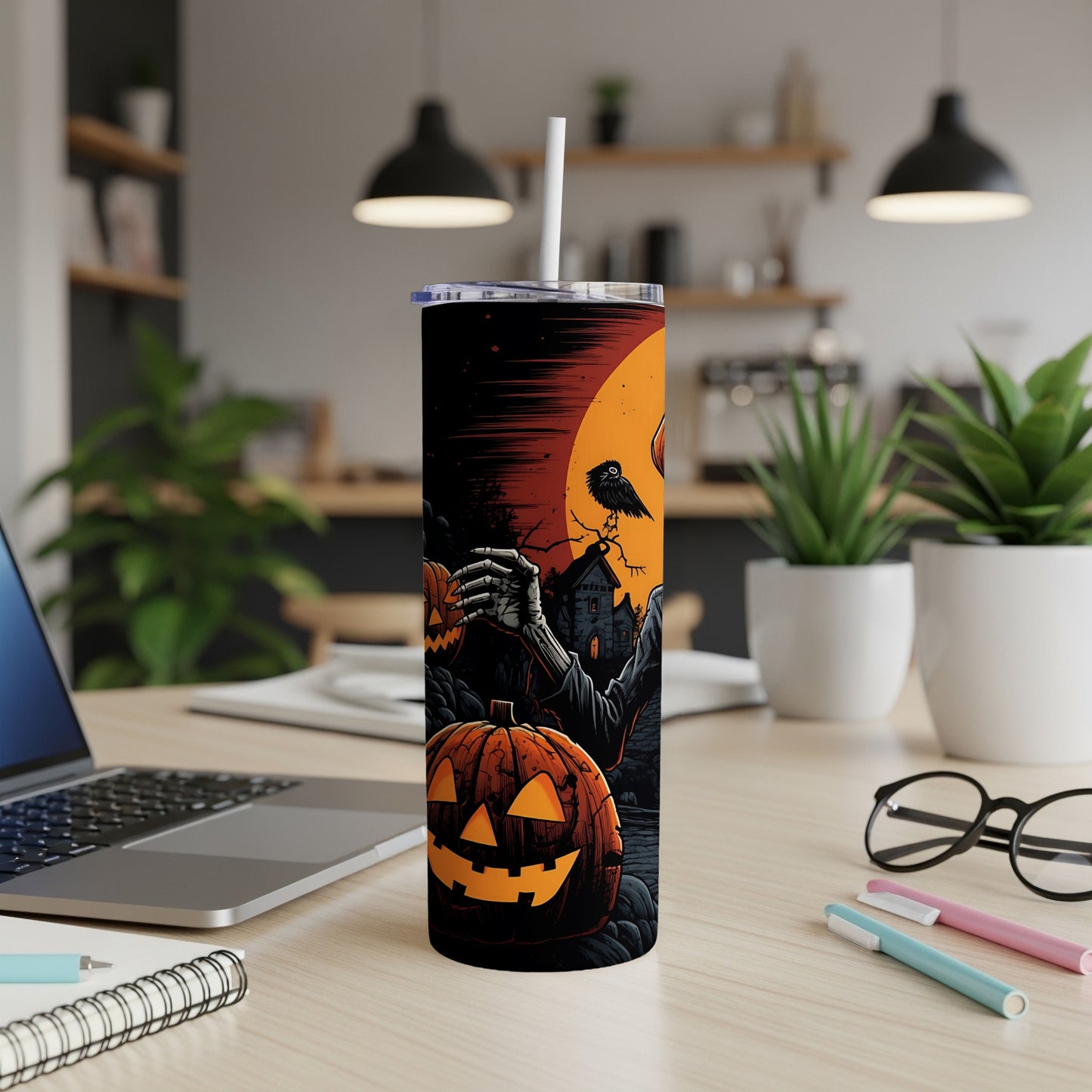 Halloween tumbler with jack-o'-lanterns, skeleton hand, and spooky house under an orange moon.