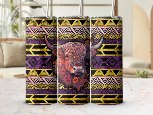 Highland cow with floral accents on a patterned tumbler.