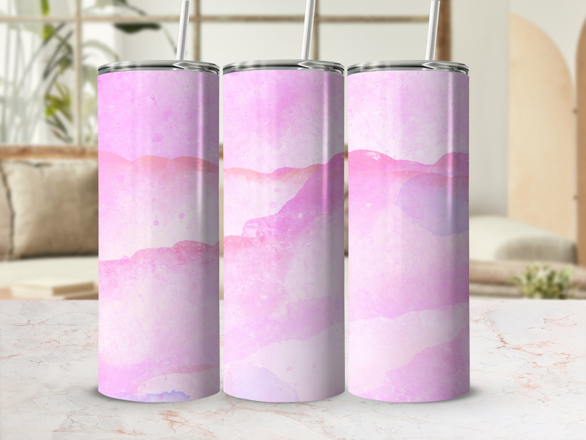 Pink watercolor abstract pattern on three tumblers with straws.