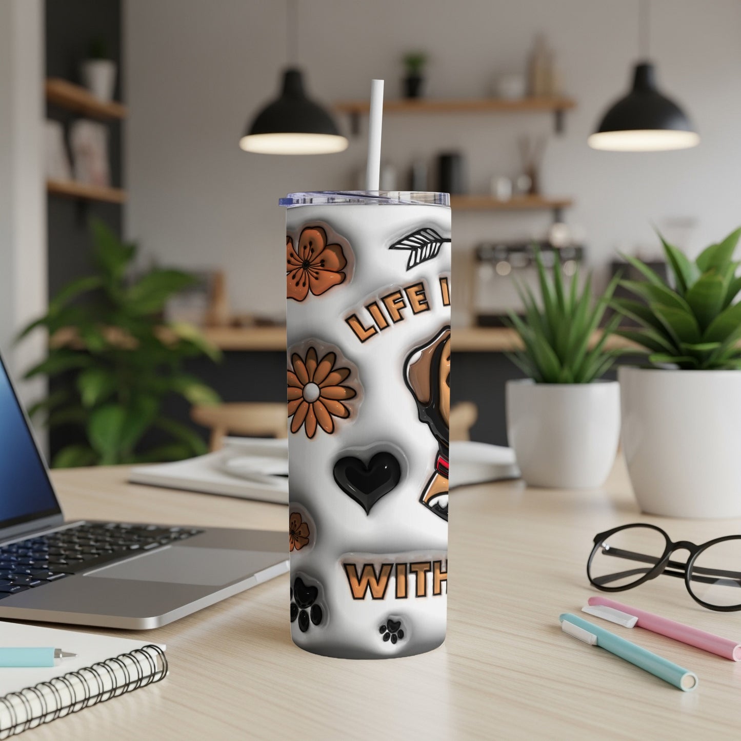 White tumbler with dog graphic, flowers, and "Life is better with..." text.
