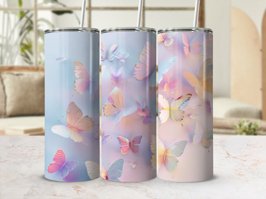 Three tumblers with pastel butterflies against a soft, blurred background.