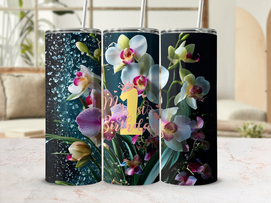 Tumbler with orchids and "1st Birthday" text.