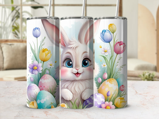 Easter bunny surrounded by colorful eggs and spring flowers on a tumbler.