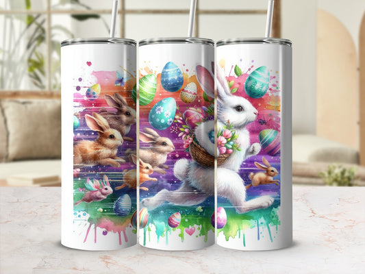 Easter bunnies with colorful eggs and watercolor splashes on a skinny tumbler.