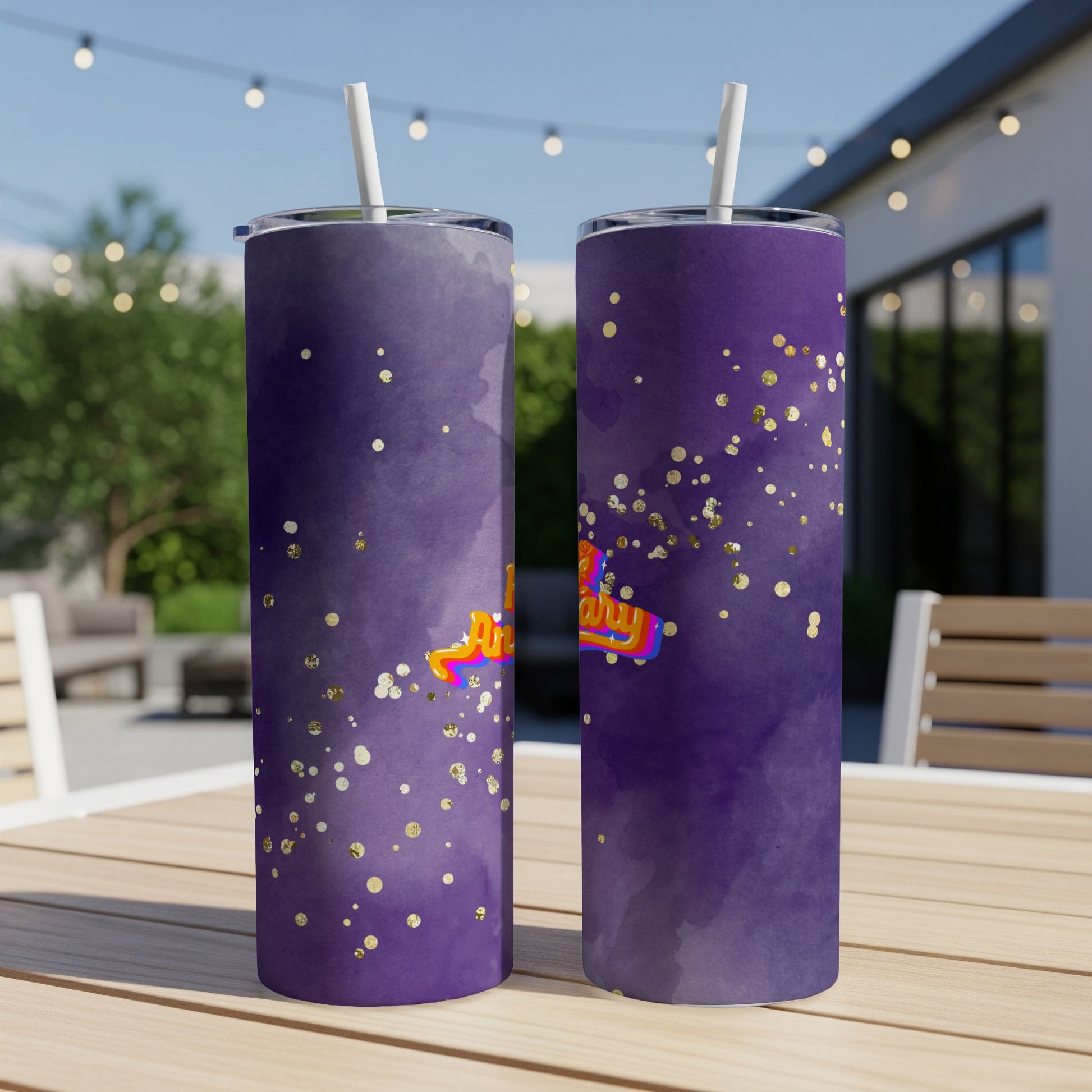 Purple tumbler with gold glitter and "happy birthday" text.