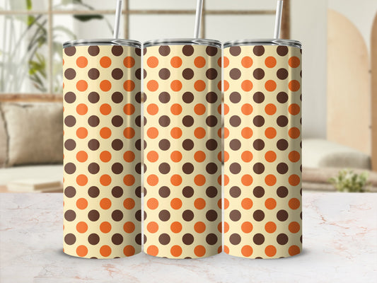 Three tumblers with a light cream background and brown and orange polka dots.