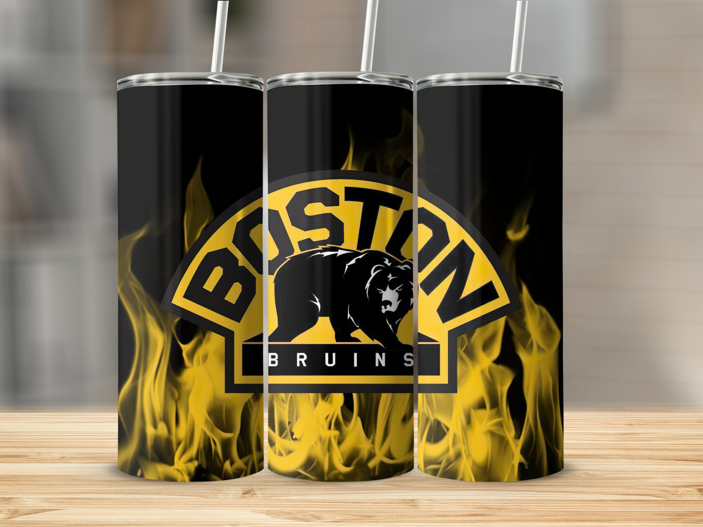 Boston Bruins logo with flames on black tumblers with white straws.