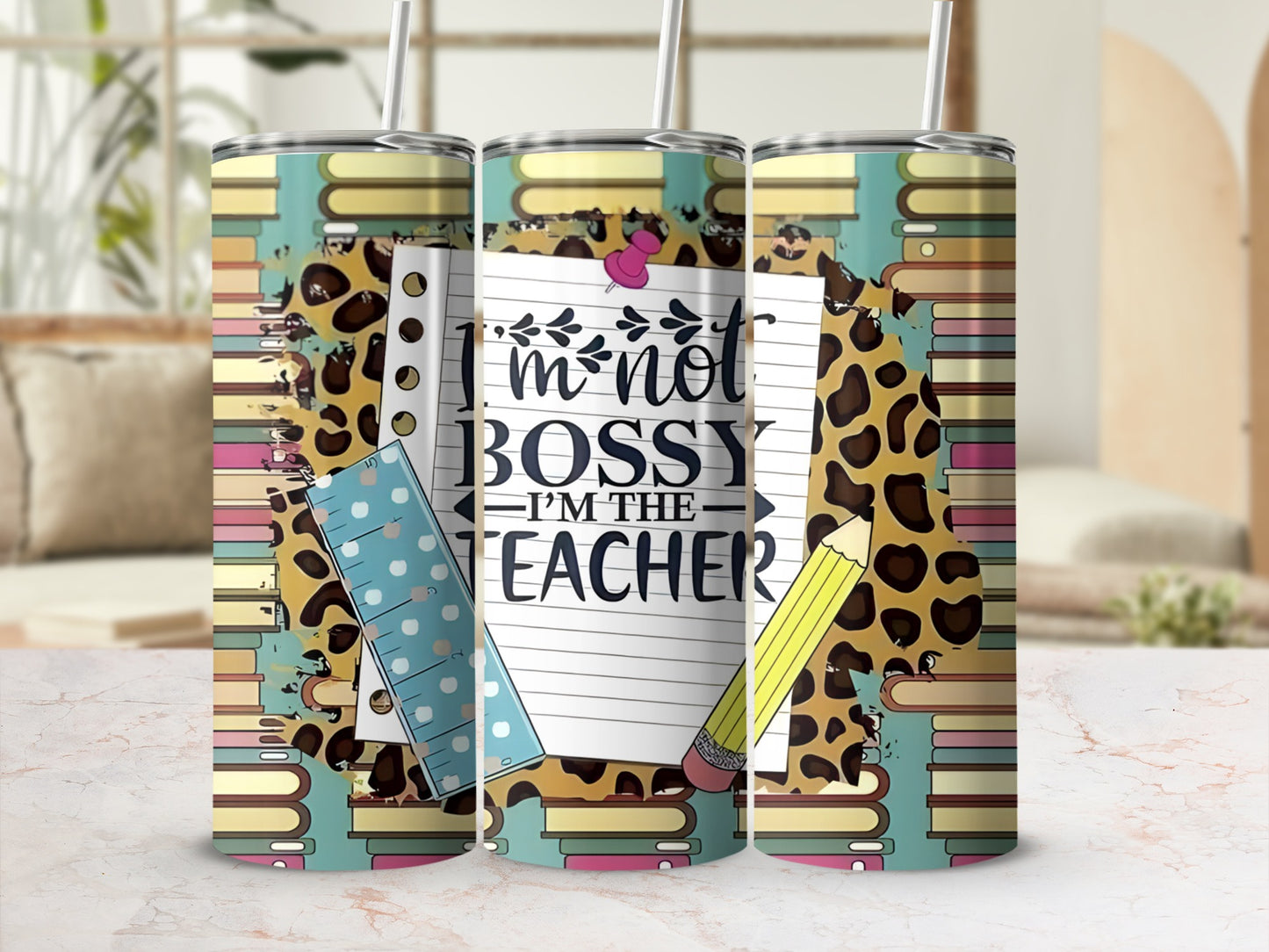 Tumbler with "I'm not bossy, I'm the teacher" text, ruler, and pencil.