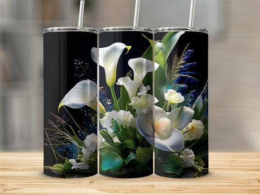 Three black tumblers with a floral design of white calla lilies and green foliage.