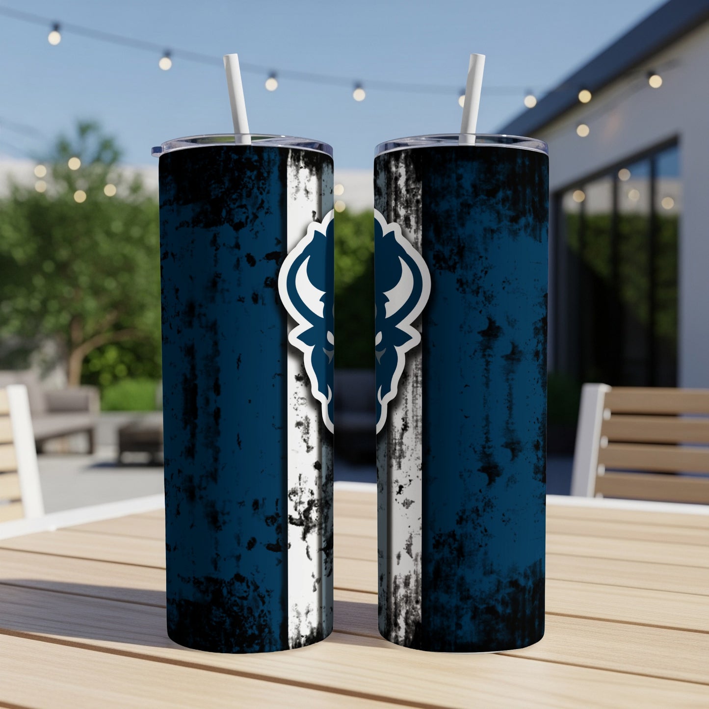 Two blue tumblers with white straws and a distressed white stripe with a dark blue emblem.