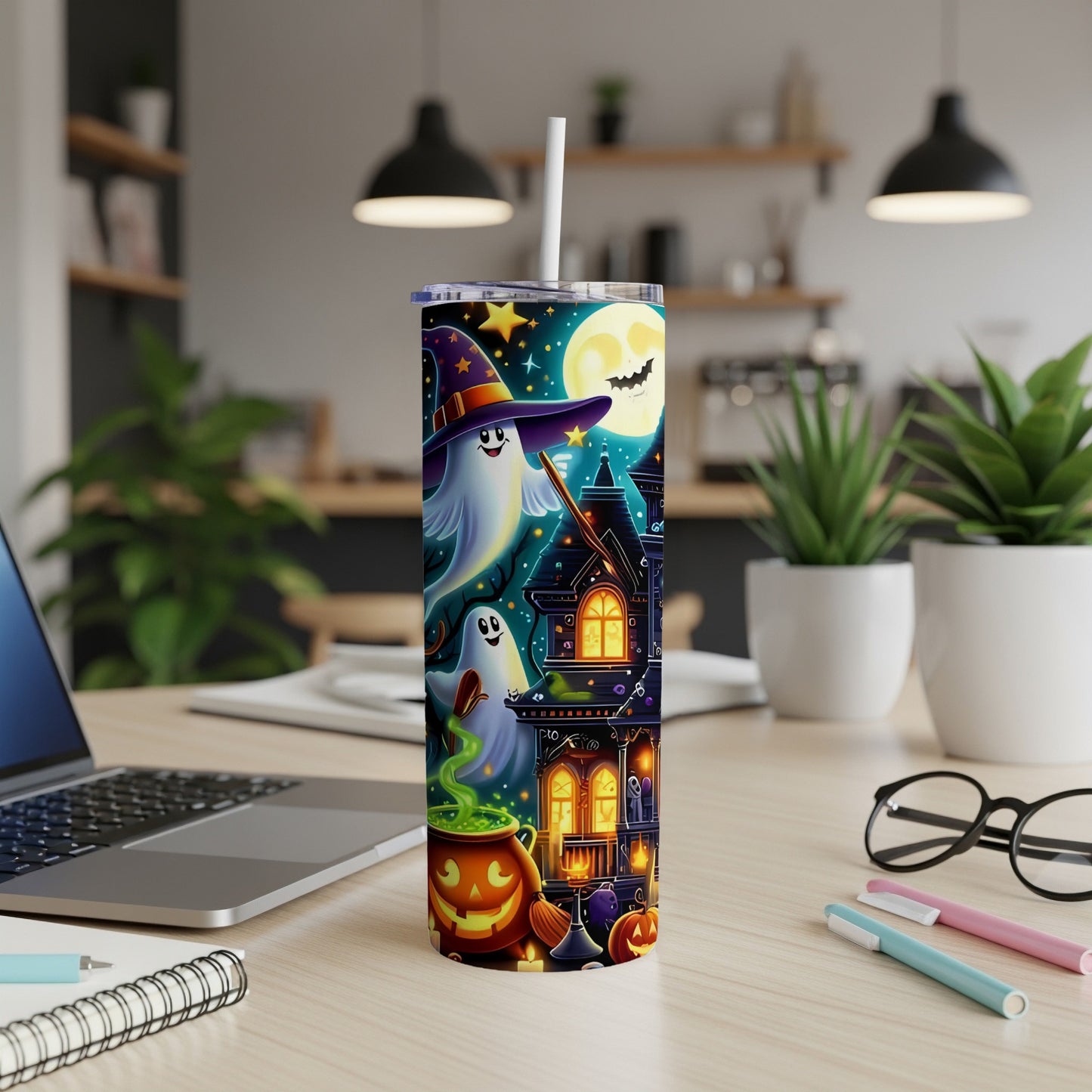 Tall tumbler with Halloween theme: ghosts, haunted house, moon, and pumpkins.