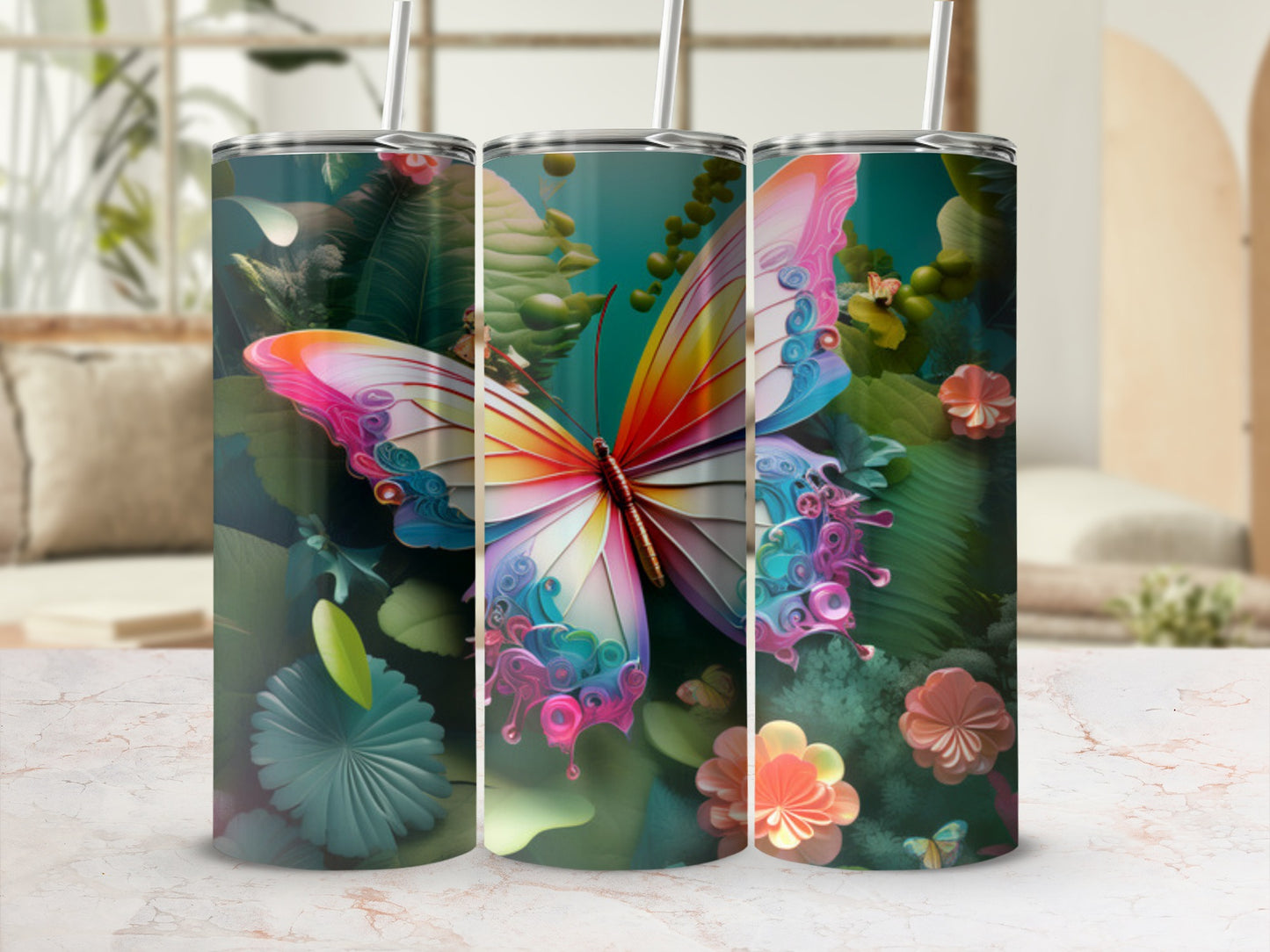 Butterfly and floral design on three stainless steel tumblers.