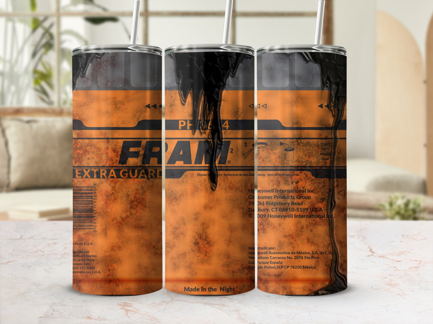 Fram Extra Guard oil filter with dark liquid and text on a textured orange background.