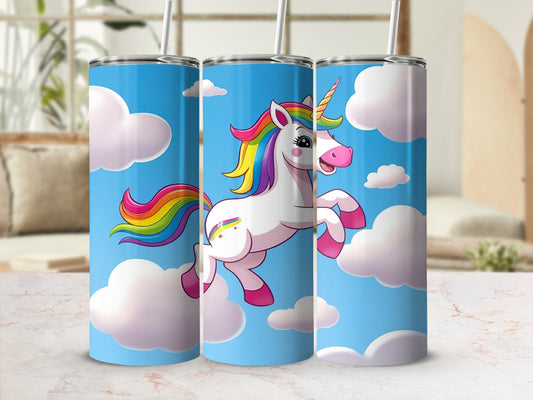Tumbler with a cartoon unicorn and rainbow against a blue sky with clouds.
