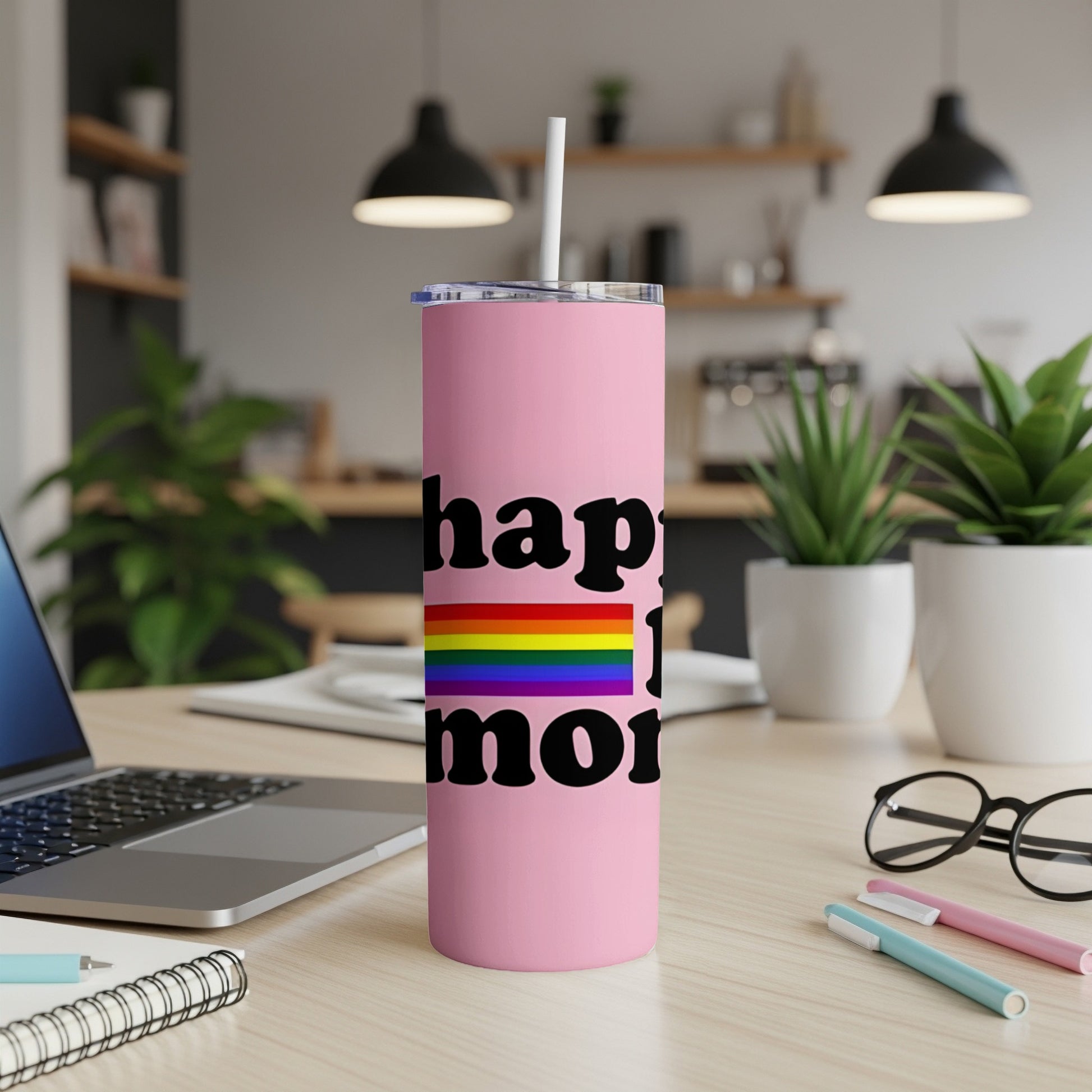 Pink tumbler with "happy pride" text and rainbow flag.
