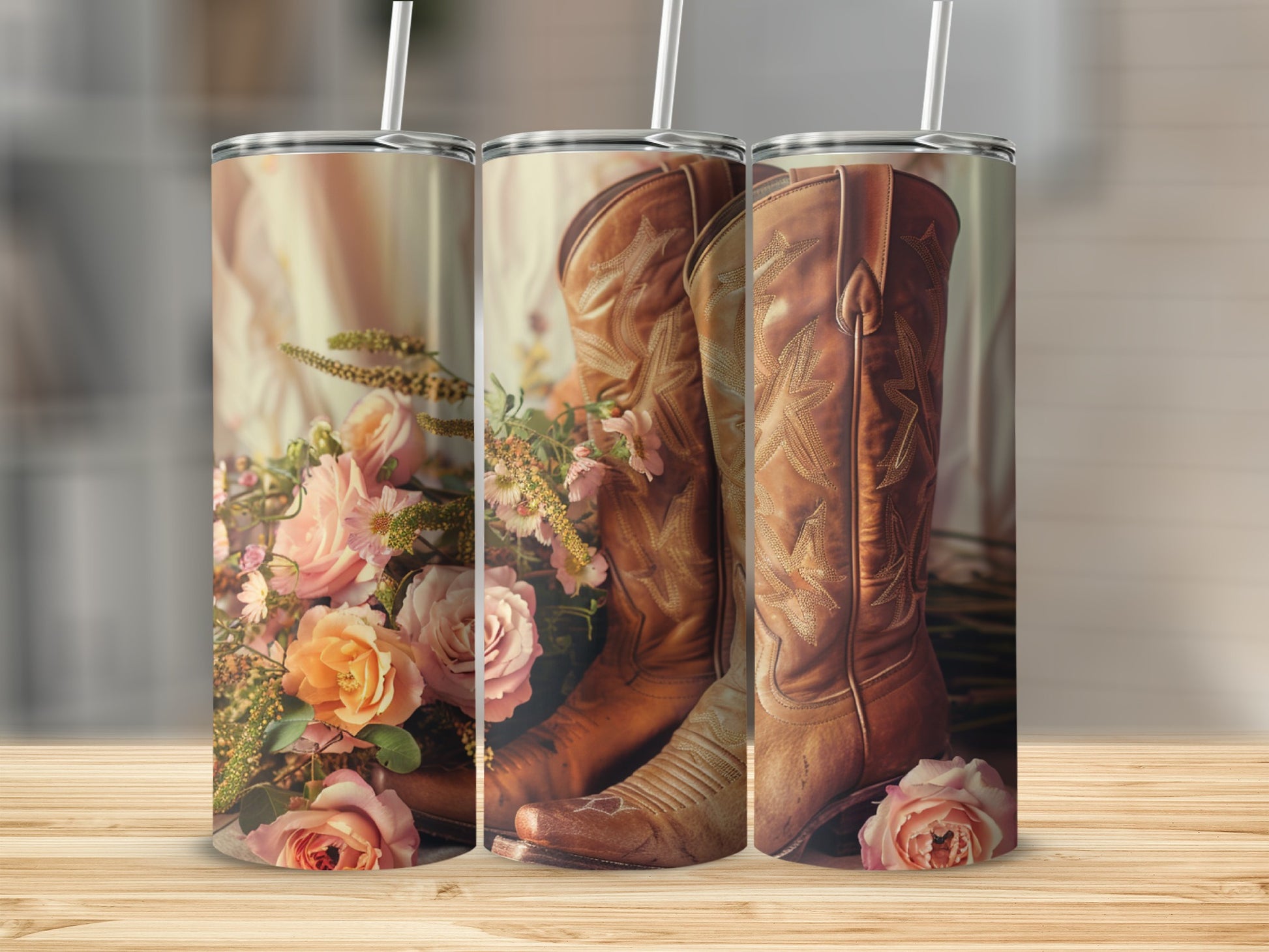 Brown cowboy boots with pink roses and greenery, shown on a tumbler.