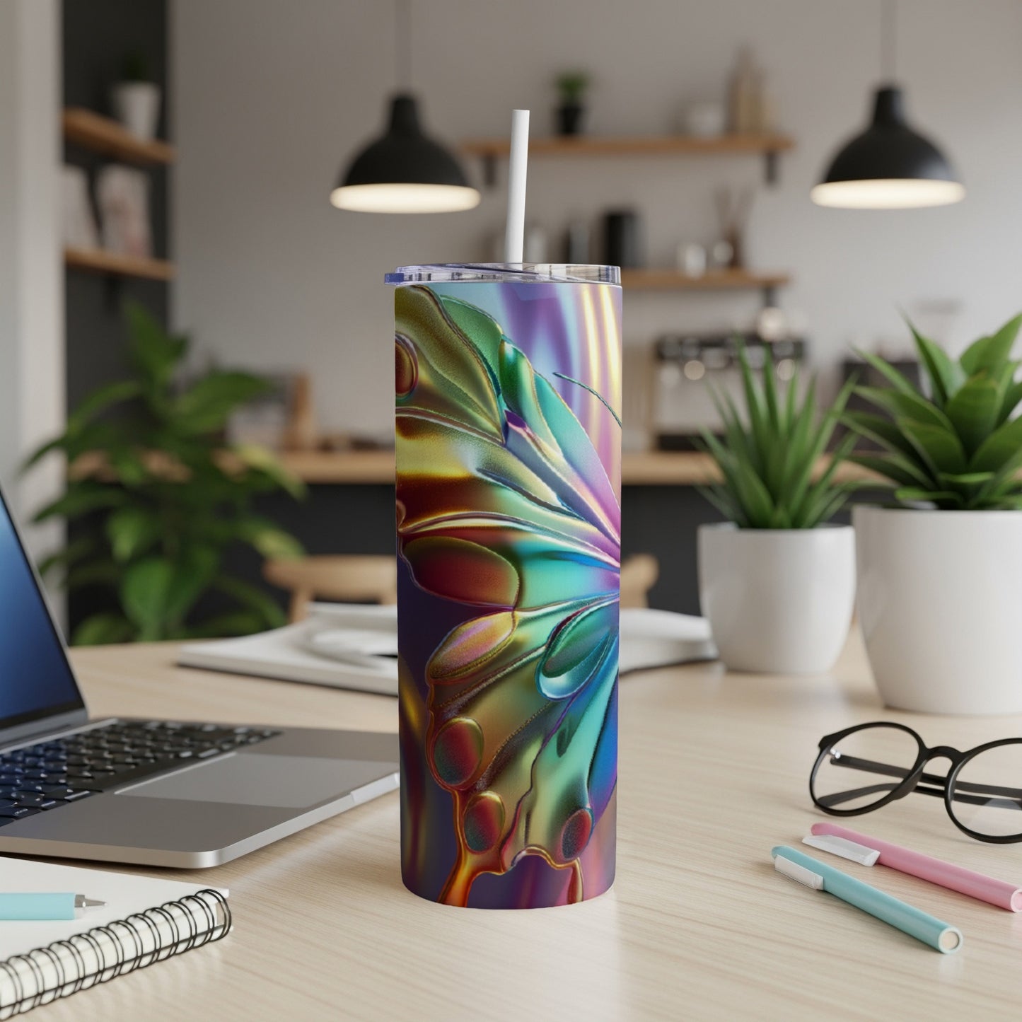 Iridescent butterfly wing design on a white tumbler with straw.
