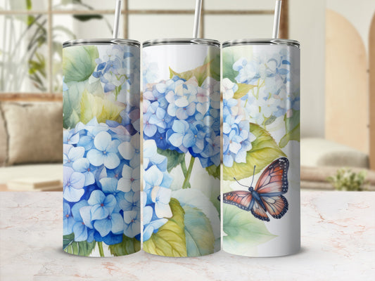 Three tumblers with blue hydrangeas and a butterfly.