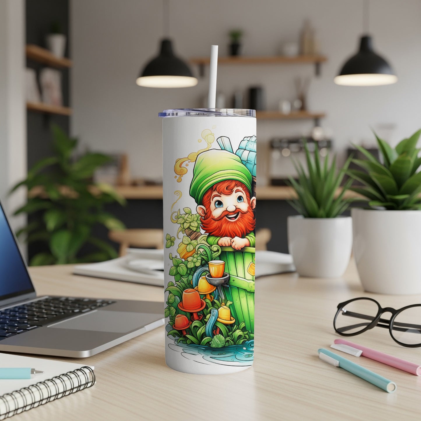 Leprechaun character on a St. Patrick's Day themed tumbler with colorful pens nearby.