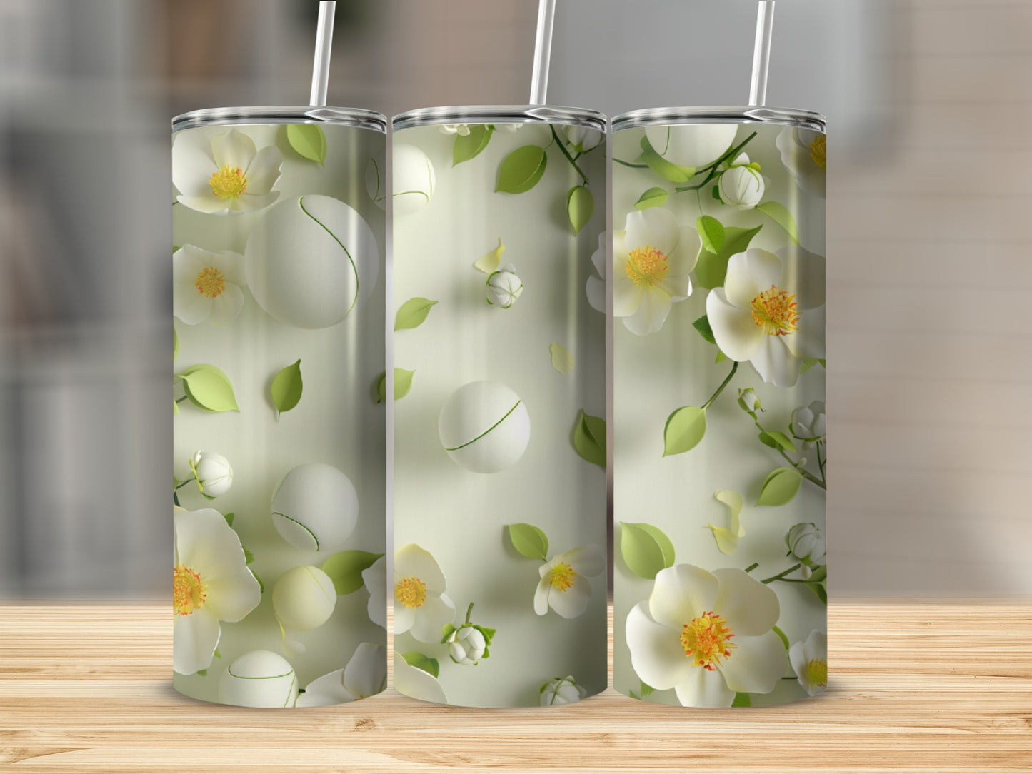 Three tumblers with a delicate floral and green leaf pattern.