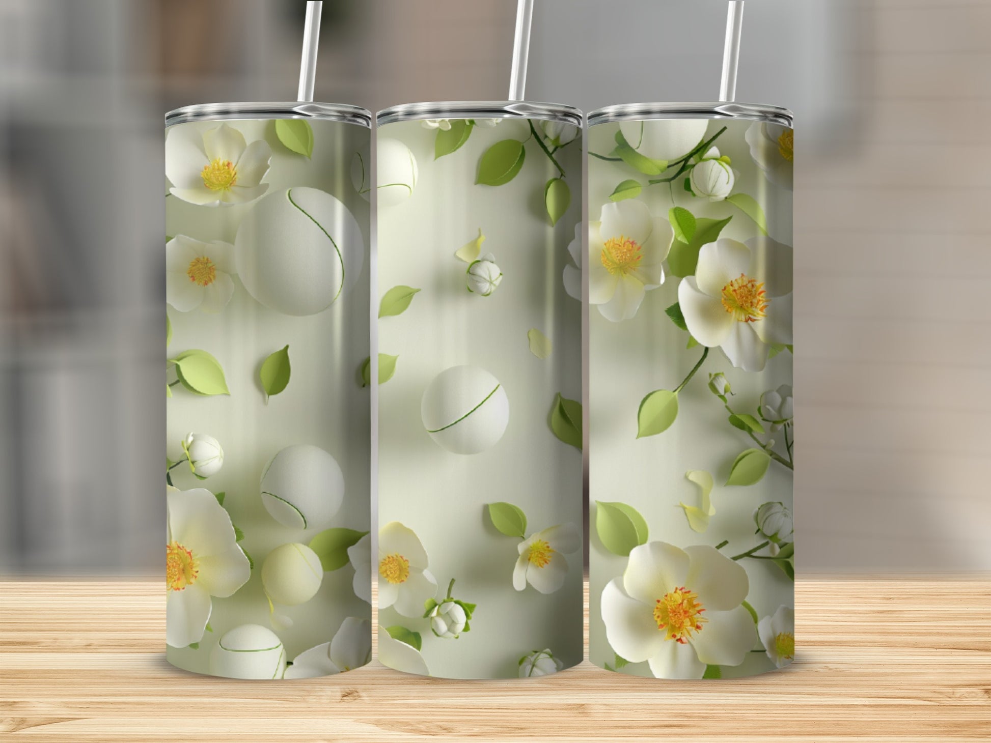 Three tumblers with a delicate floral and green leaf pattern.