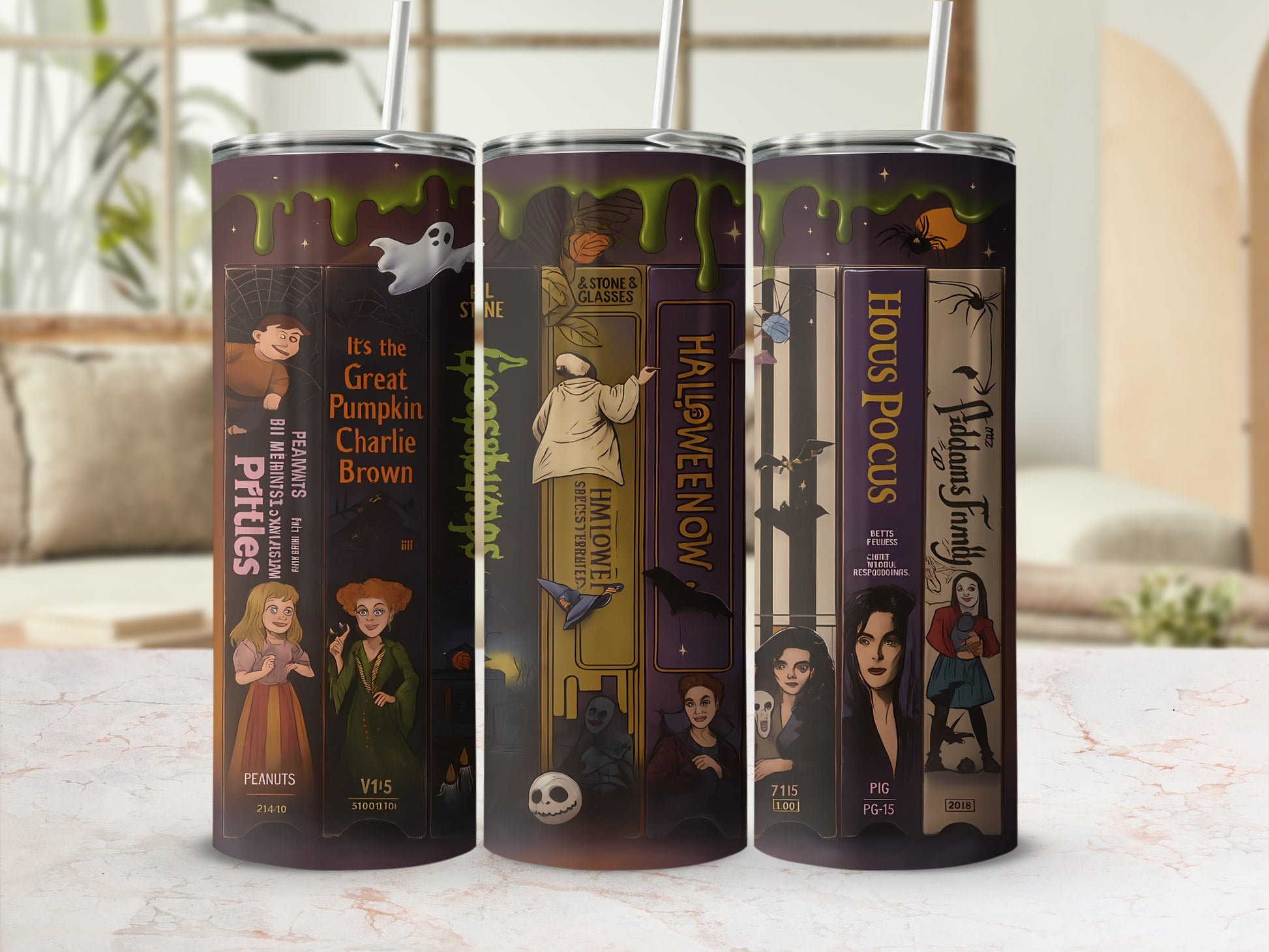 Tumblers with Halloween movie themes: Charlie Brown, Hocus Pocus, and Addams Family.