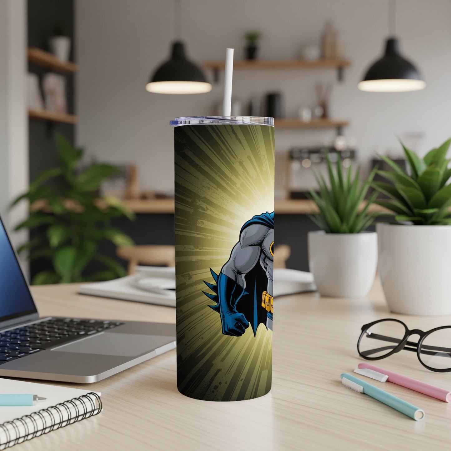 Batman illustration on a stainless steel tumbler with a straw.