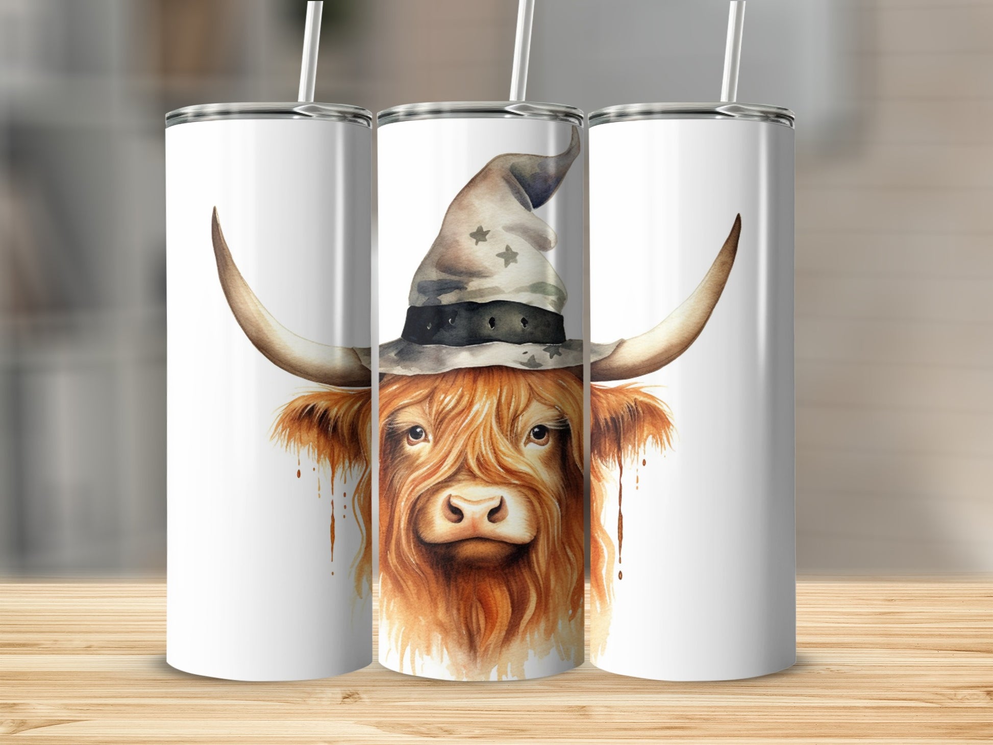 Highland cow wearing witch hat, splattered paint design on white tumbler.