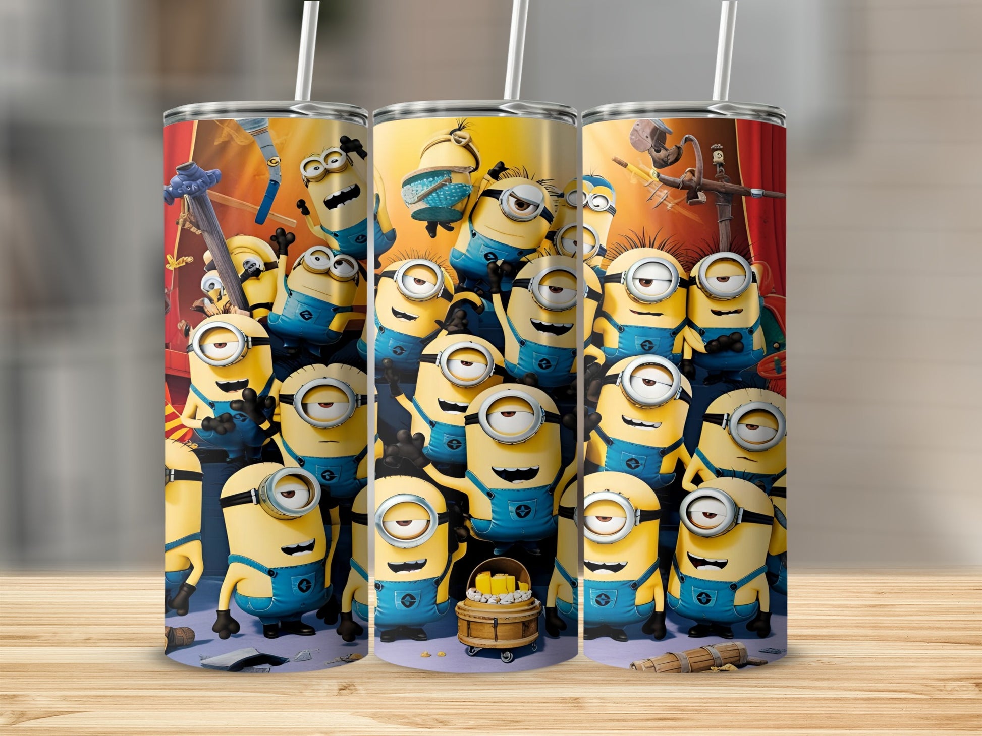 Three Minions themed tumblers with multiple Minion characters in a group formation.