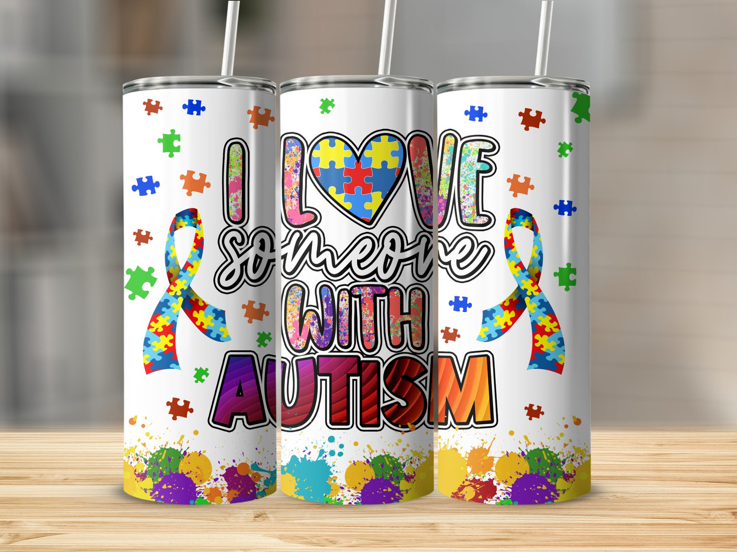 Tumbler with "I Love Someone with Autism" and puzzle pieces.