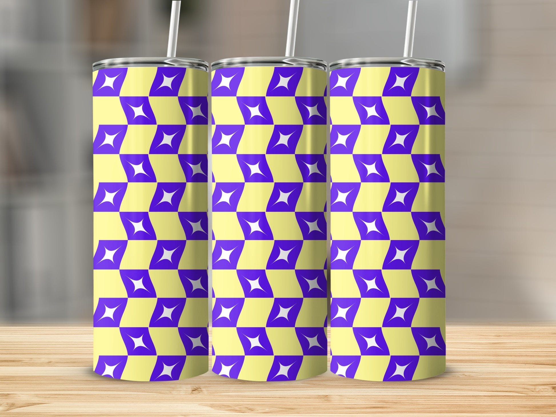 Three tumblers with a purple and yellow geometric star pattern.