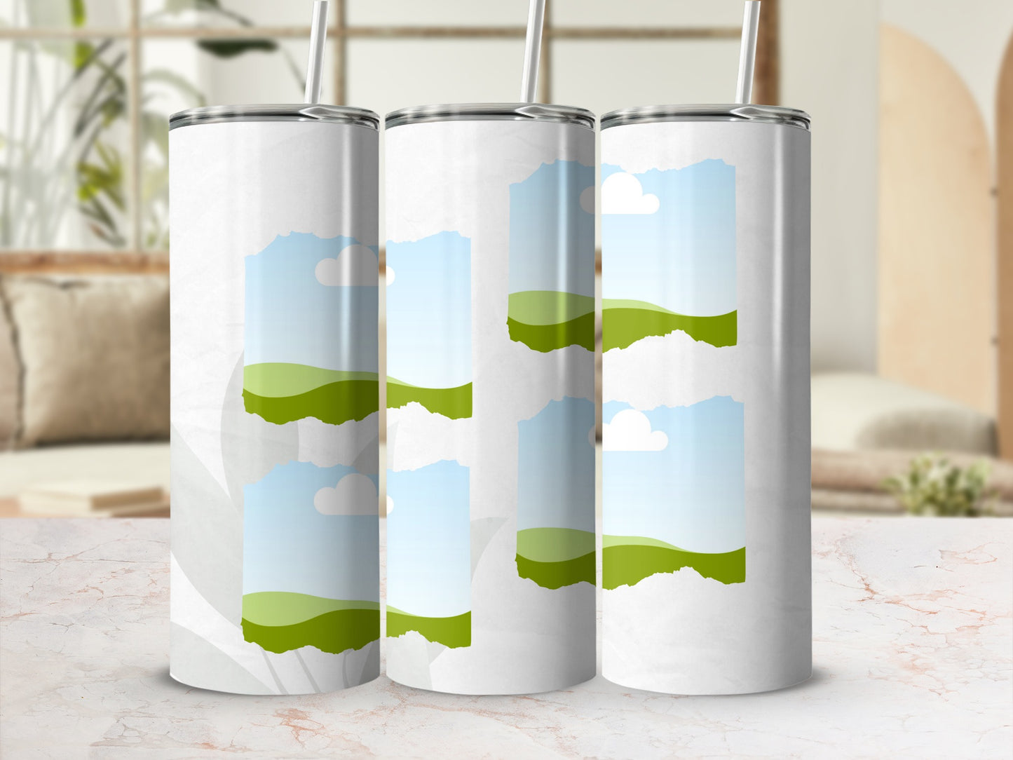 Three white tumblers with a sky and rolling green hills graphic design.