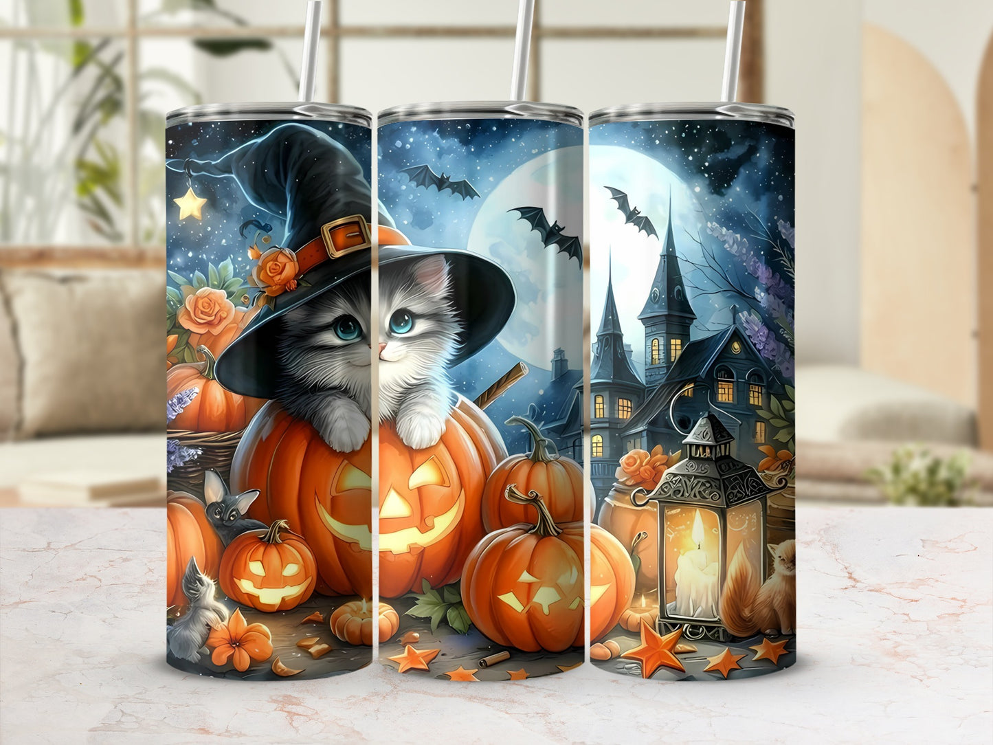 Three tumblers with Halloween art featuring a kitten in a witch hat, pumpkins, and a haunted house.