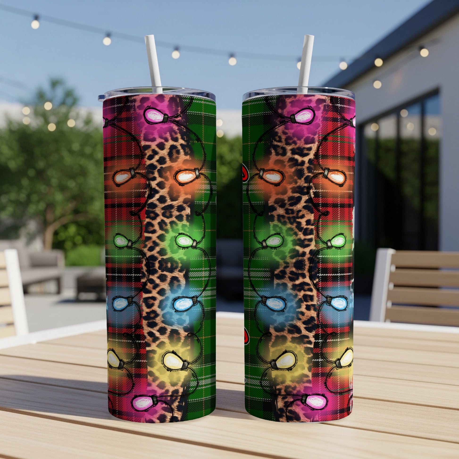 Two tumblers with Christmas lights on plaid and leopard print.