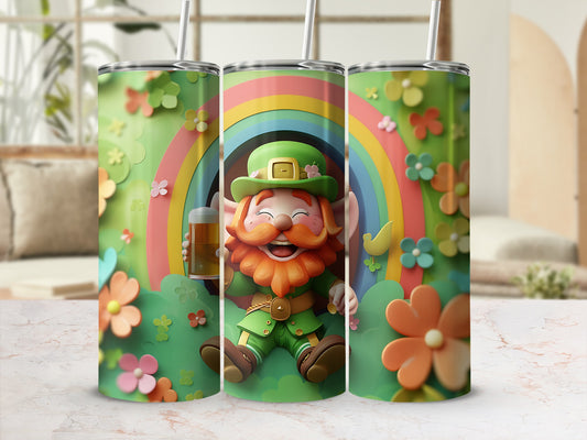 Green leprechaun holding a beer mug with rainbow and flowers on tumbler.