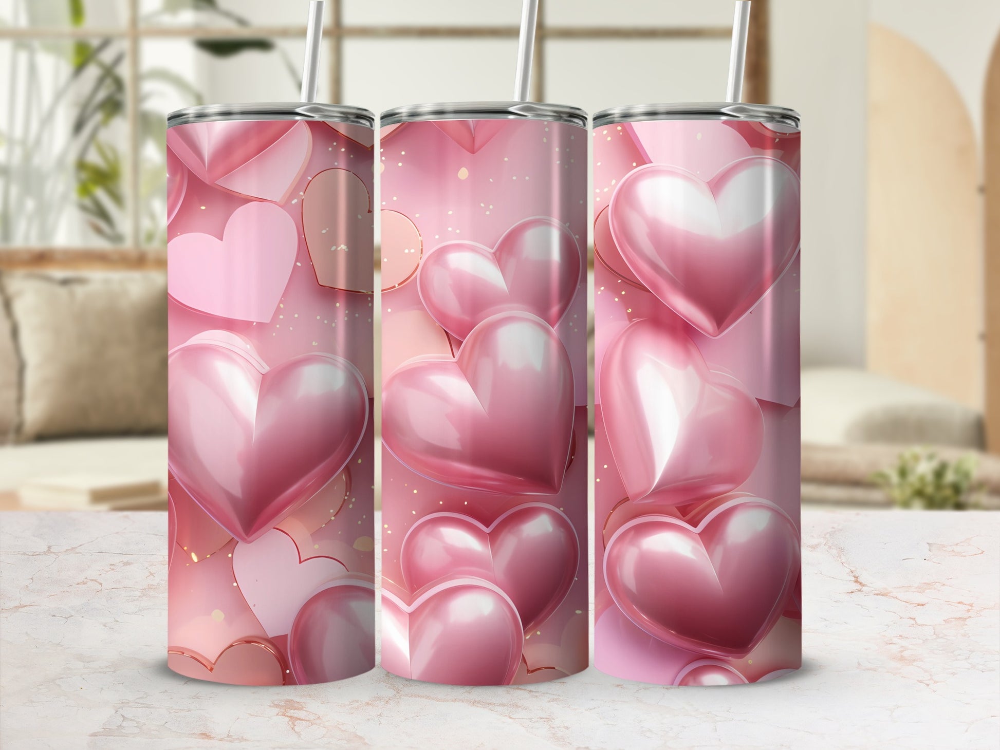 Pink hearts with gold glitter on a tumbler with a marble background.