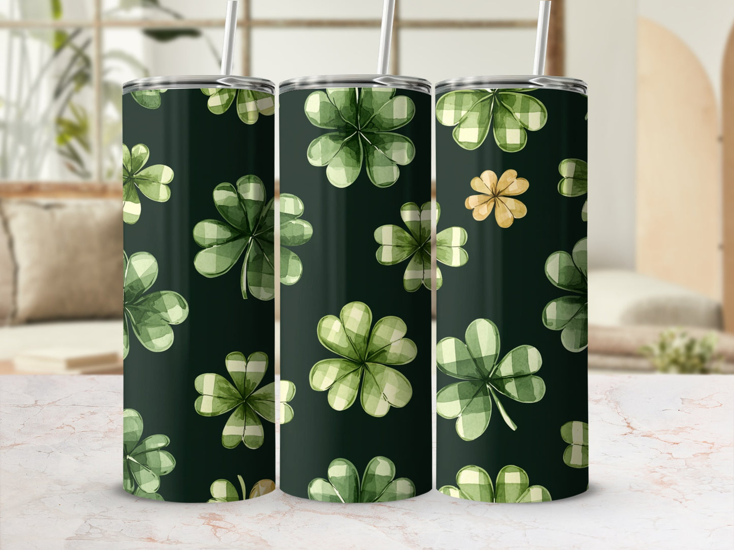 Green plaid shamrocks and a single gold clover pattern on a dark tumbler.