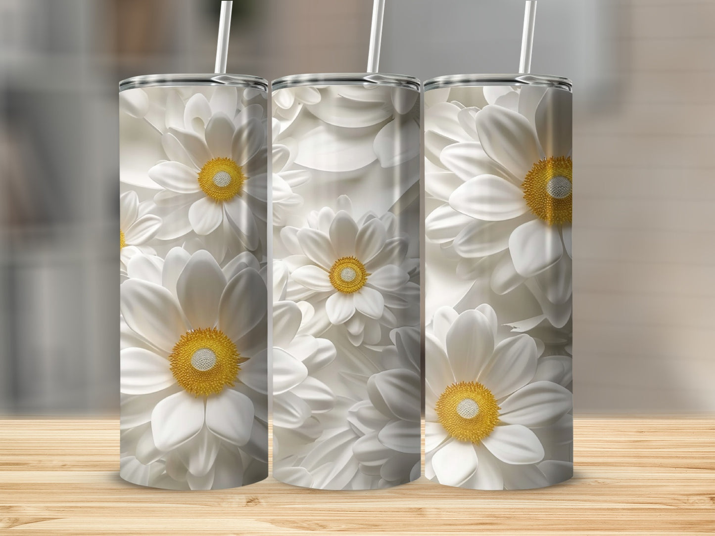 Three white daisy tumblers with yellow centers on a wooden surface.