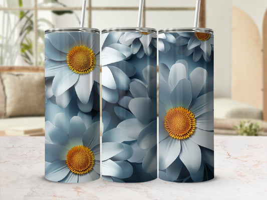 Three blue floral tumblers with yellow centers, displayed on a marble surface.