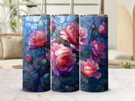 Three stained glass tumblers with pink roses against a blue background.