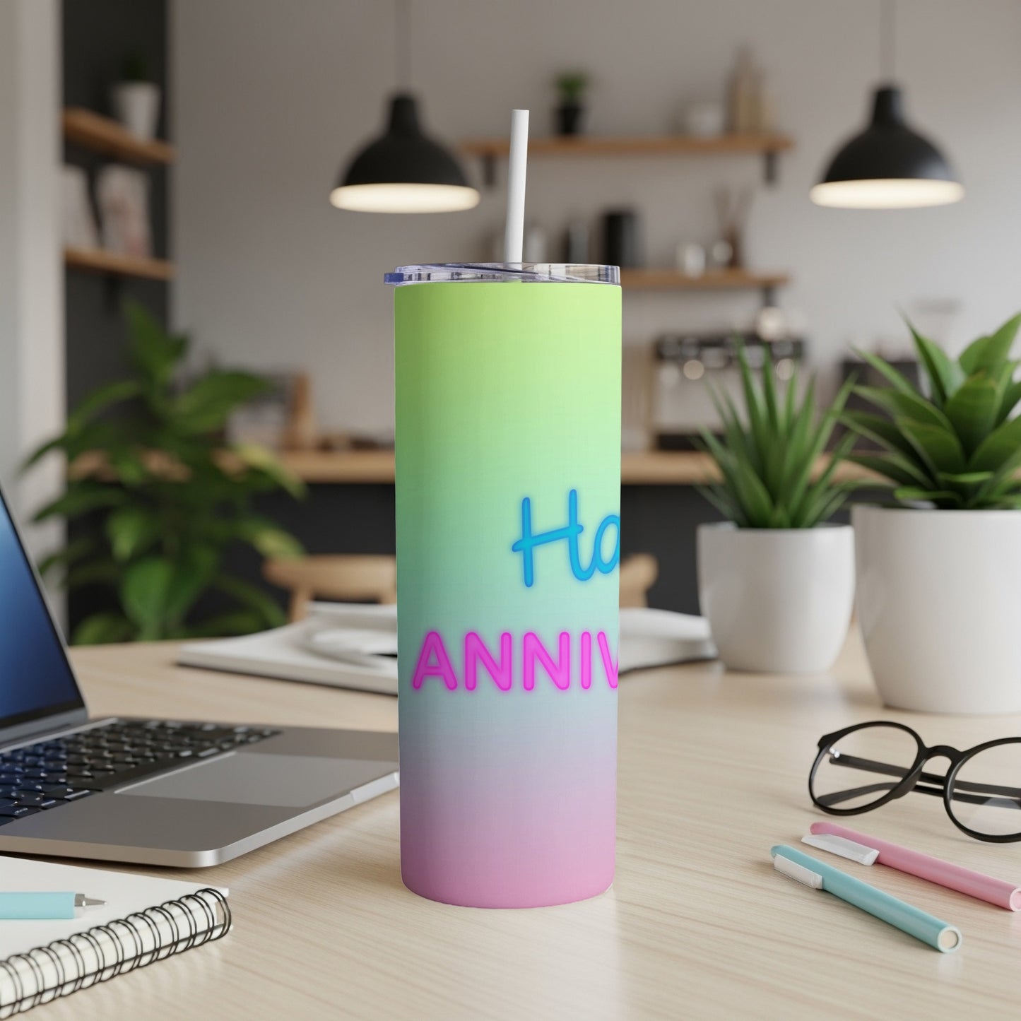 Gradient tumbler with "Happy Anniversary" text on a desk.
