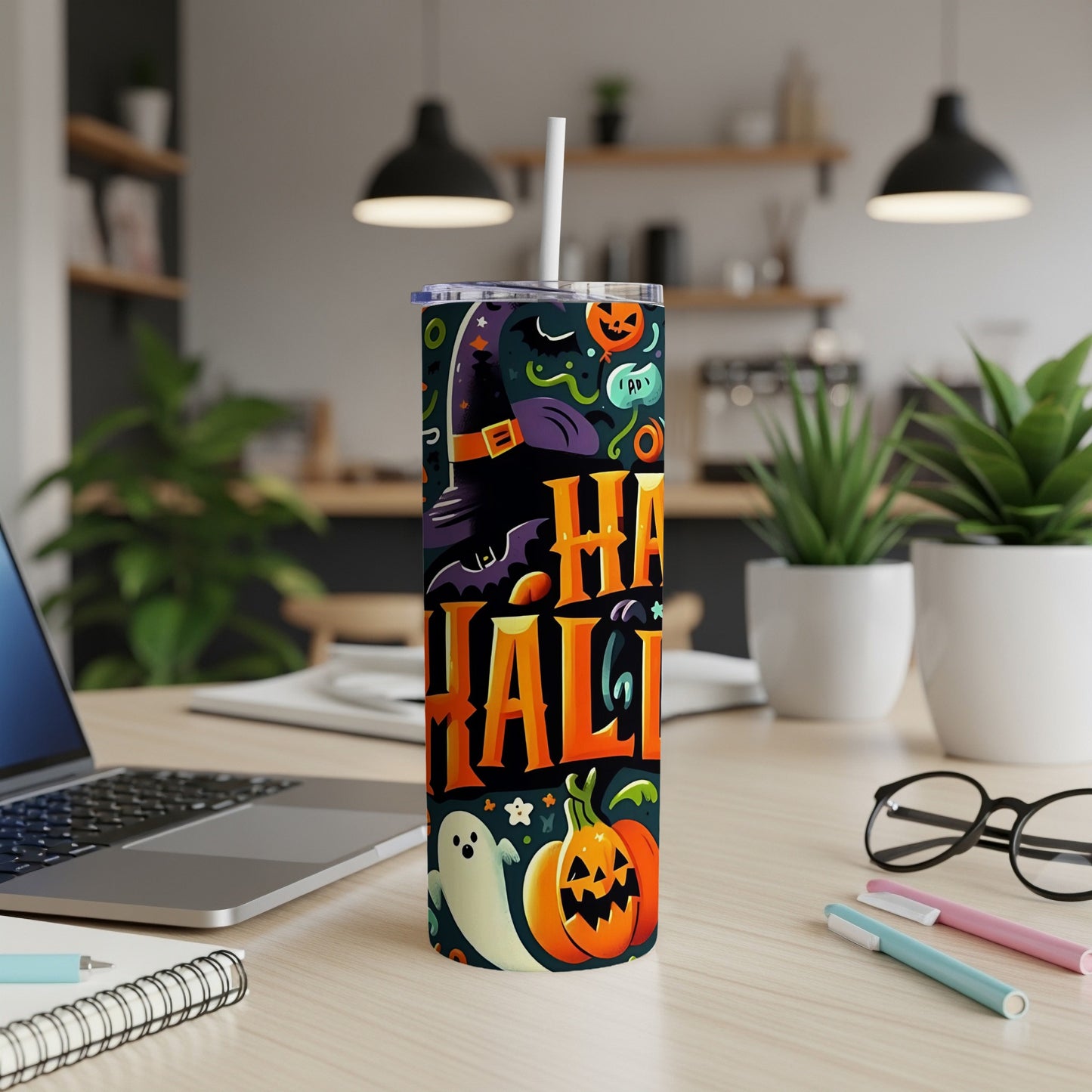 Tall tumbler with a Halloween design featuring "Happy Halloween" text and spooky graphics.