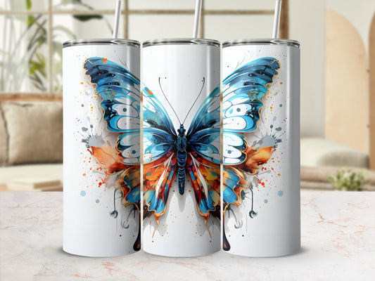 Three white tumblers with a colorful butterfly design and splattered paint accents.