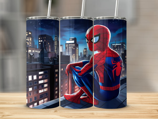 Spiderman perched on a city rooftop at night.