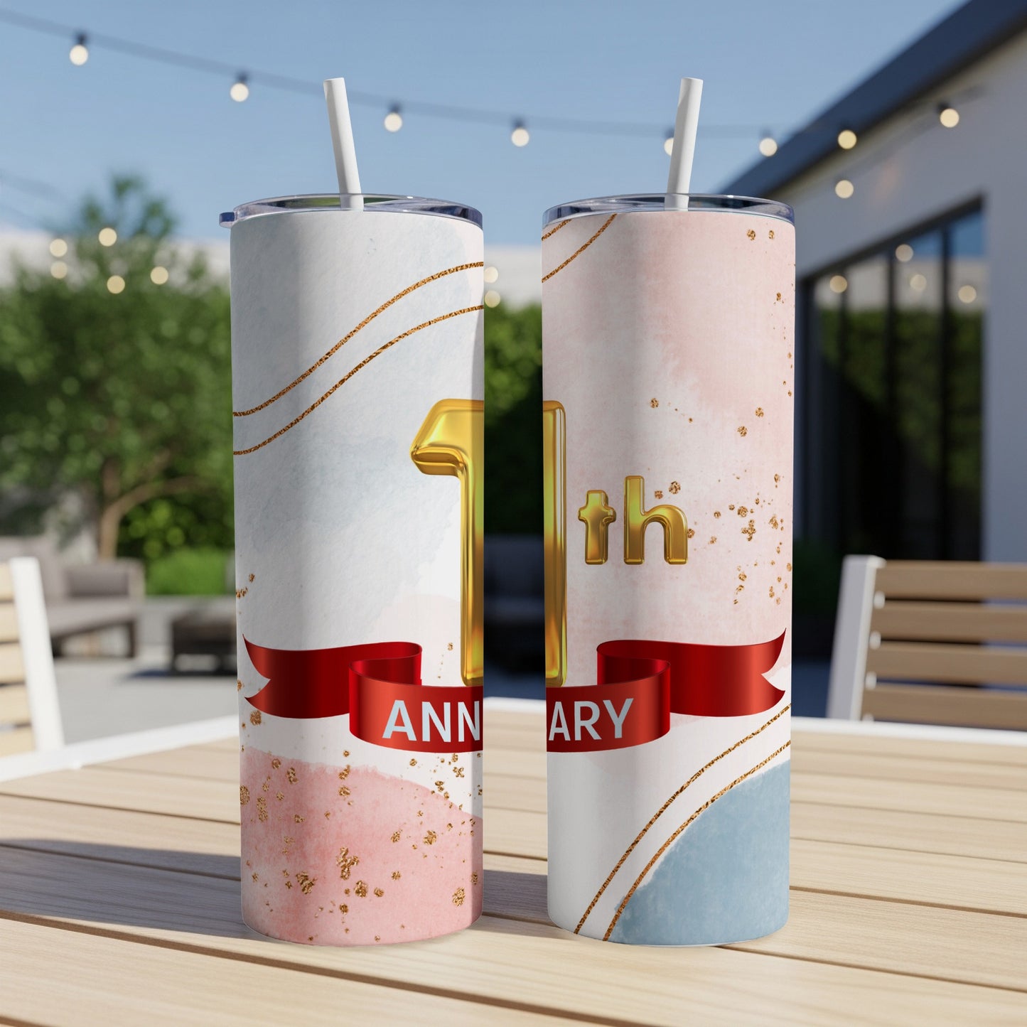 Gold "1st Anniversary" text on two pink and blue watercolor tumblers with gold accents.