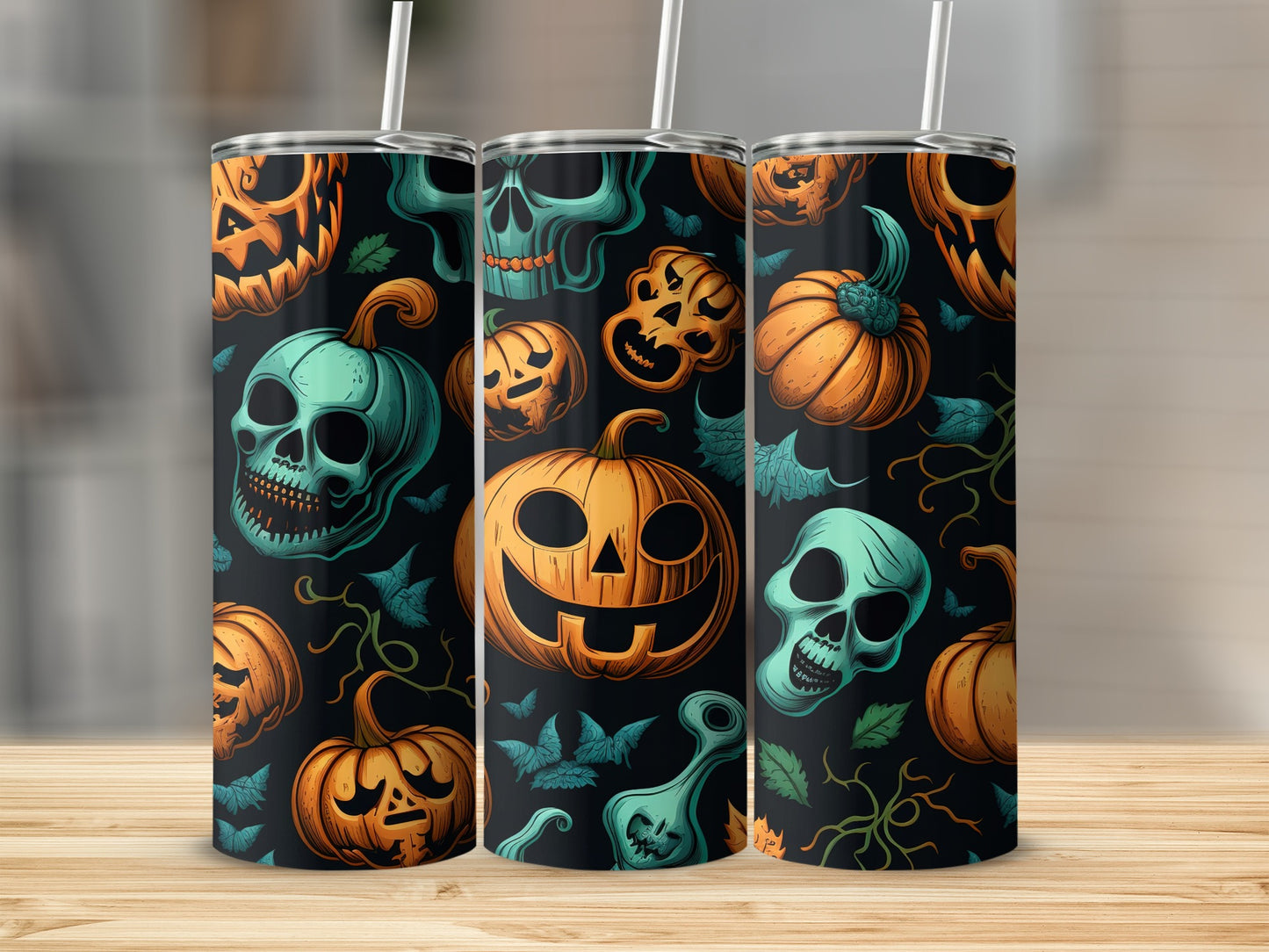 Tumblers with a Halloween pattern featuring pumpkins and skulls on a black background.