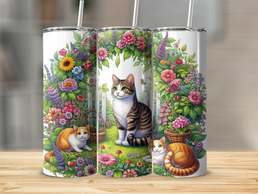 Three tumblers with cats among colorful flowers and greenery.
