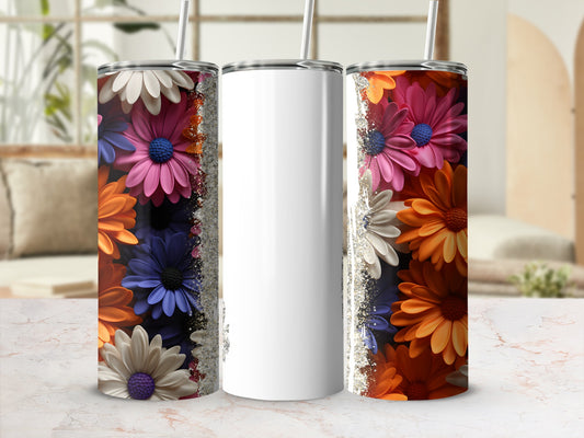 Three tumblers with colorful floral patterns and glitter accents.