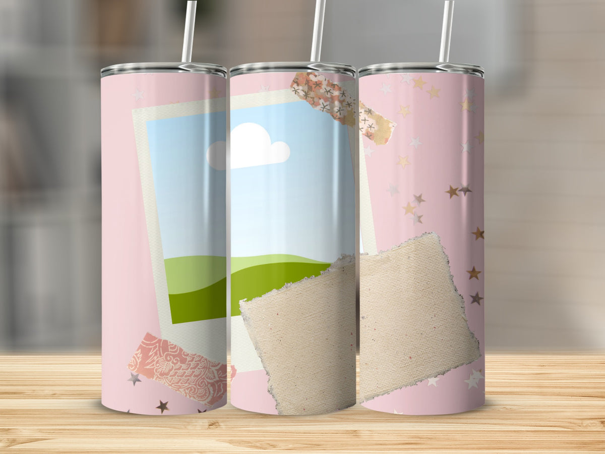 Three pink tumblers with a sky, landscape, and star pattern, adorned with torn paper.