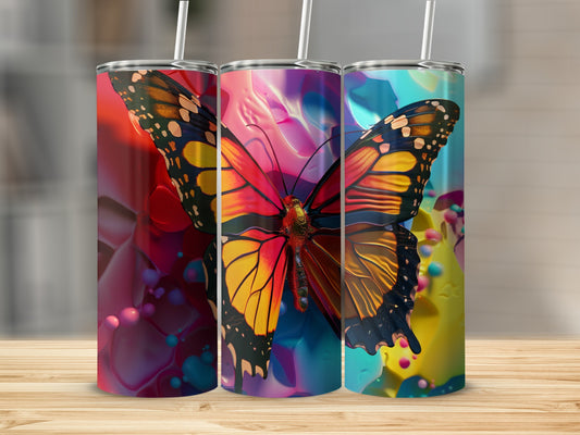 Three tumblers featuring a vibrant monarch butterfly against a colorful abstract background.